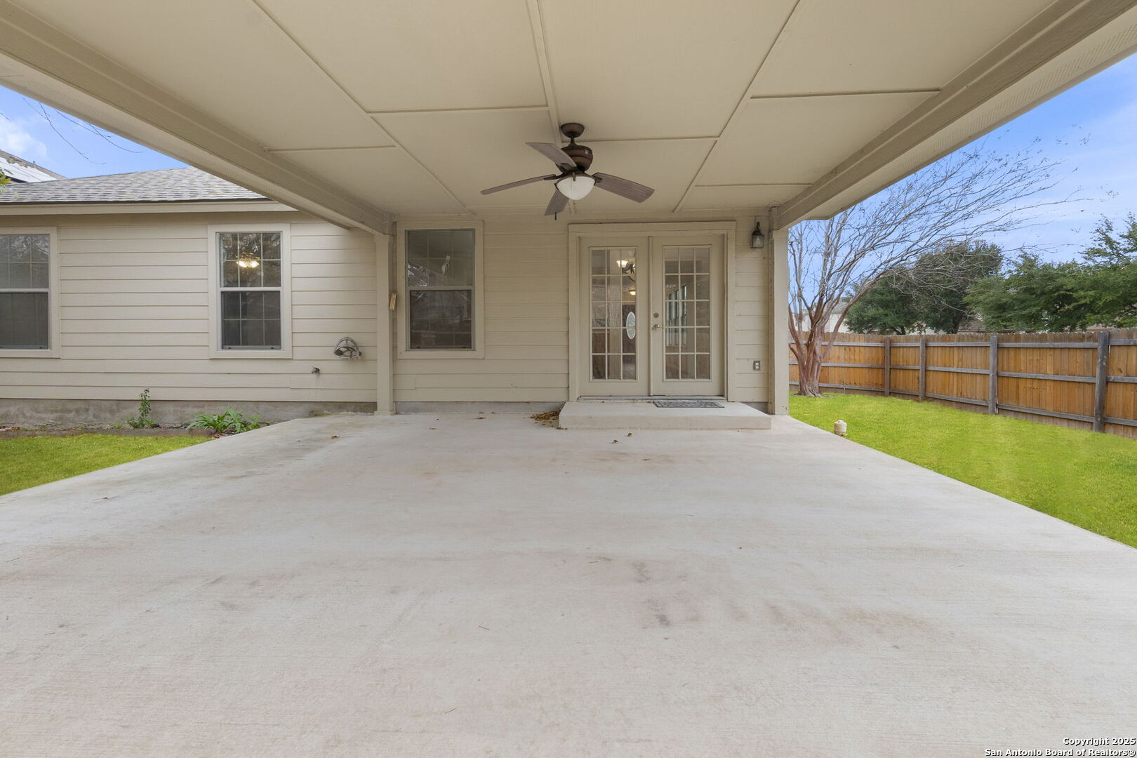 620 Waterleaf Boulevard Kyle, TX 78640 - Photo 31 of 34 a view of a house with a backyard and porch
