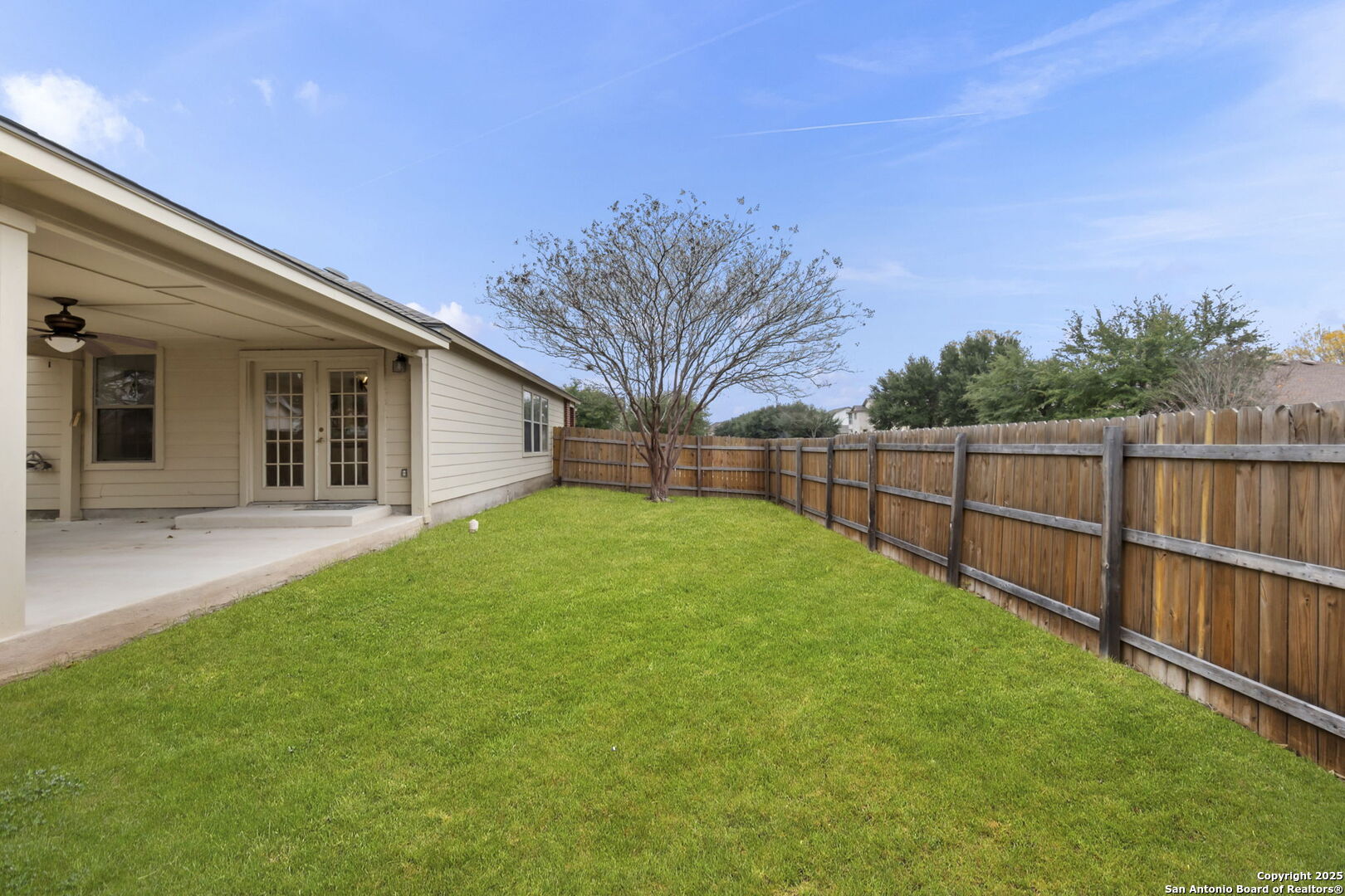 620 Waterleaf Boulevard Kyle, TX 78640 - Photo 32 of 34 a view of a backyard with wooden fence