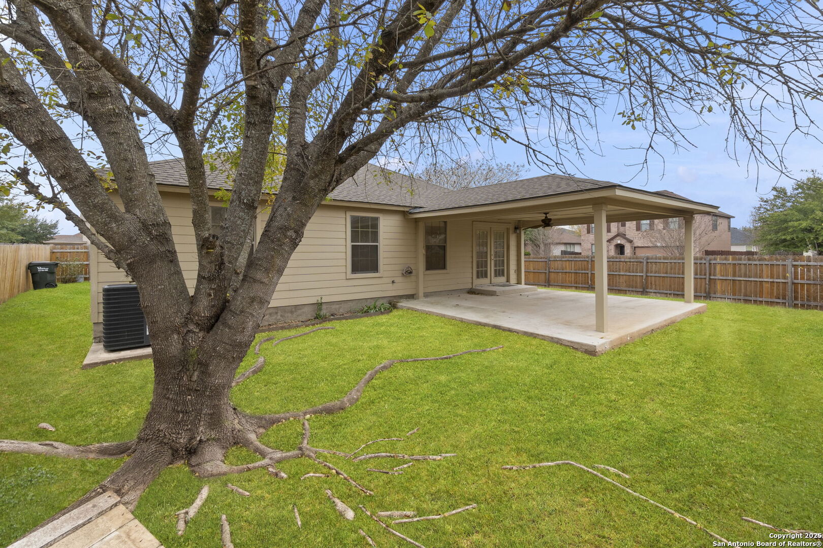 620 Waterleaf Boulevard Kyle, TX 78640 - Photo 34 of 34 a view of a house with backyard and a tree