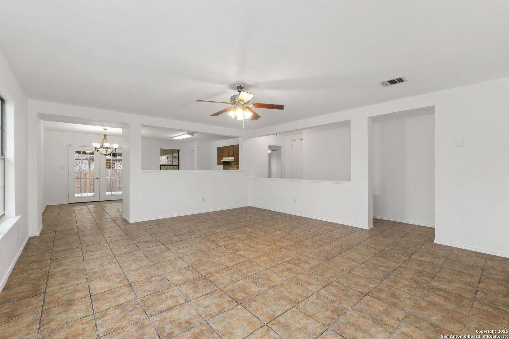 620 Waterleaf Boulevard Kyle, TX 78640 - Photo 9 of 34 a view of an empty room with a window