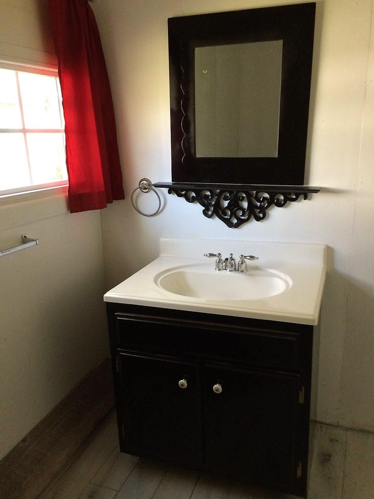 109 Cascade Hollow Road Normandy, TN 37360 - Photo 11 of 12 a bathroom with a sink vanity and a mirror