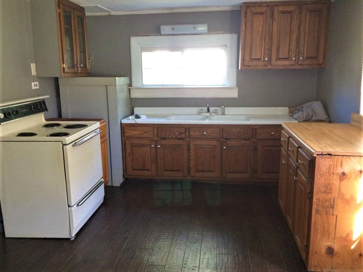 109 Cascade Hollow Road Normandy, TN 37360 - Photo 7 of 12 a kitchen with sink cabinets and window
