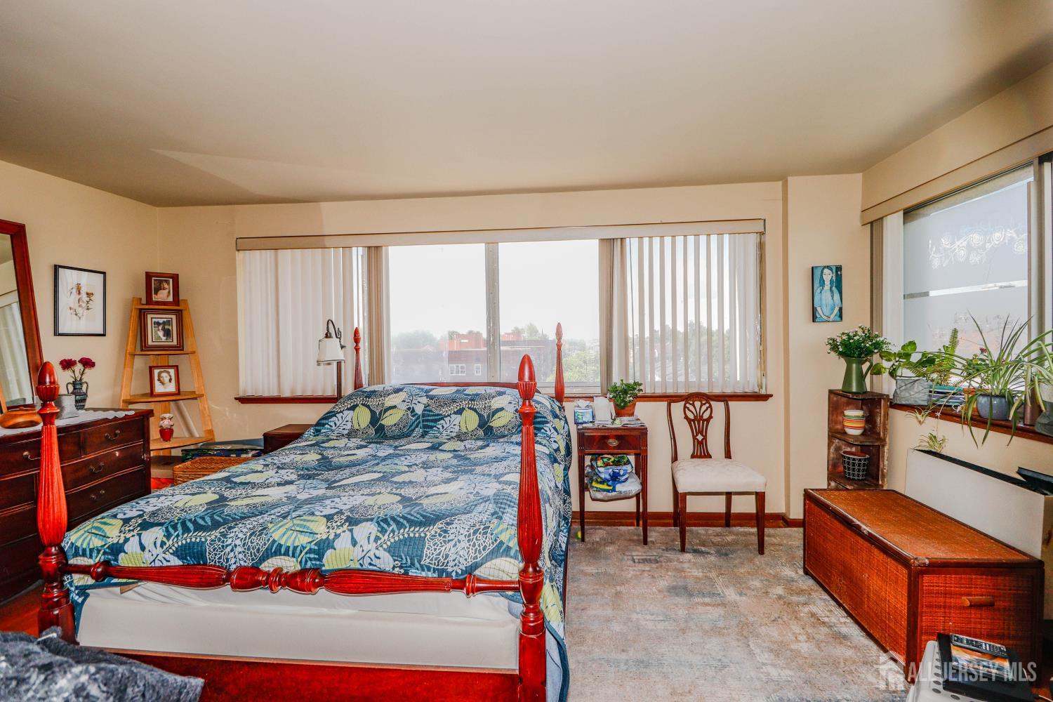 40 Fayette Street, Unit 57 Perth Amboy, NJ 08861 - Photo 20 of 33 a bed room with a bed and a couch