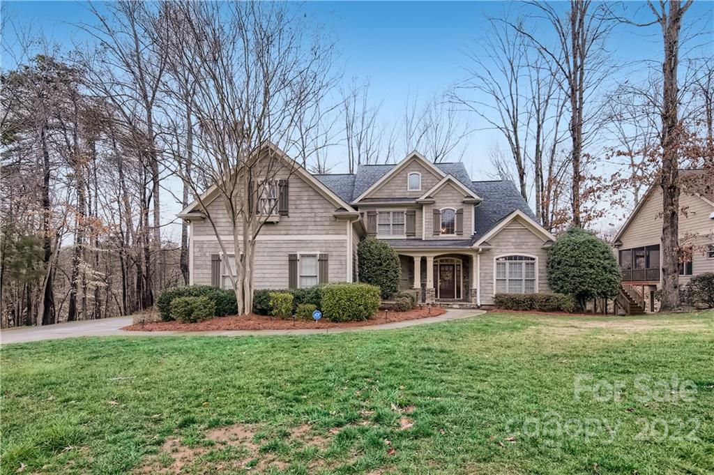 7653 Juniper Lane Denver, NC 28037 - Photo 1 of 28 a front view of a house with garden