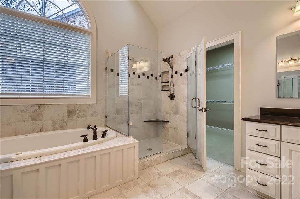 7653 Juniper Lane Denver, NC 28037 - Photo 14 of 28 a bathroom with a bathtub and a shower