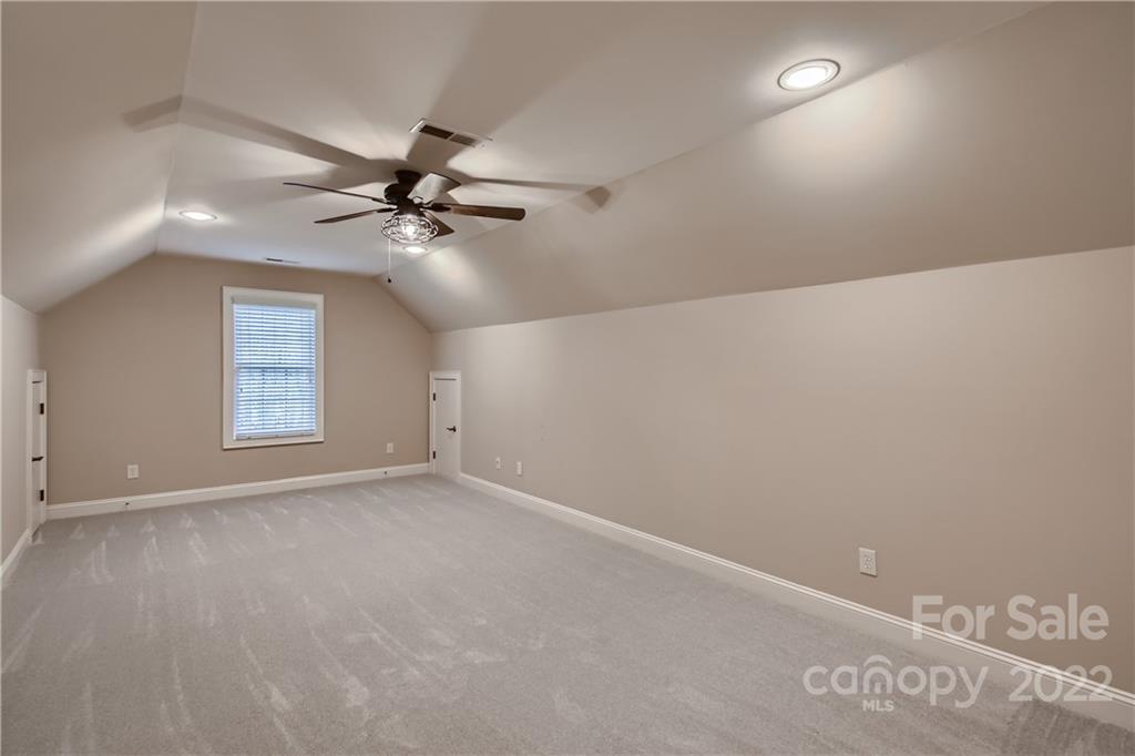 7653 Juniper Lane Denver, NC 28037 - Photo 18 of 28 an empty room with windows and fan