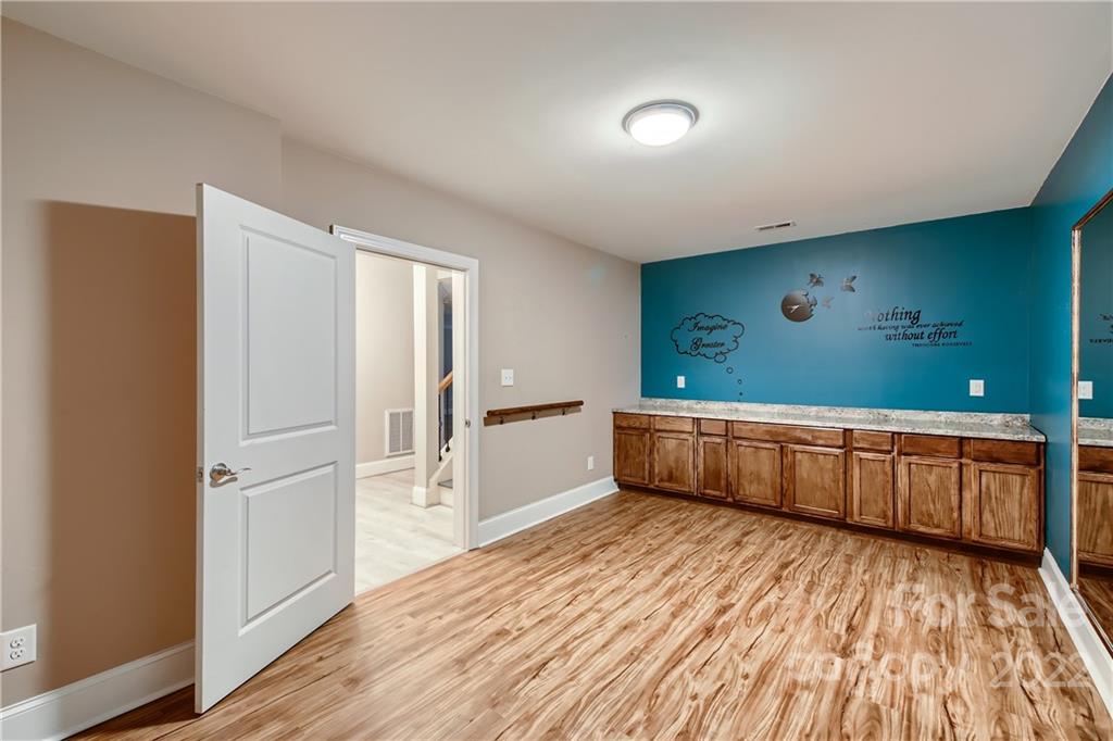 7653 Juniper Lane Denver, NC 28037 - Photo 25 of 28 a kitchen with a refrigerator and a stove