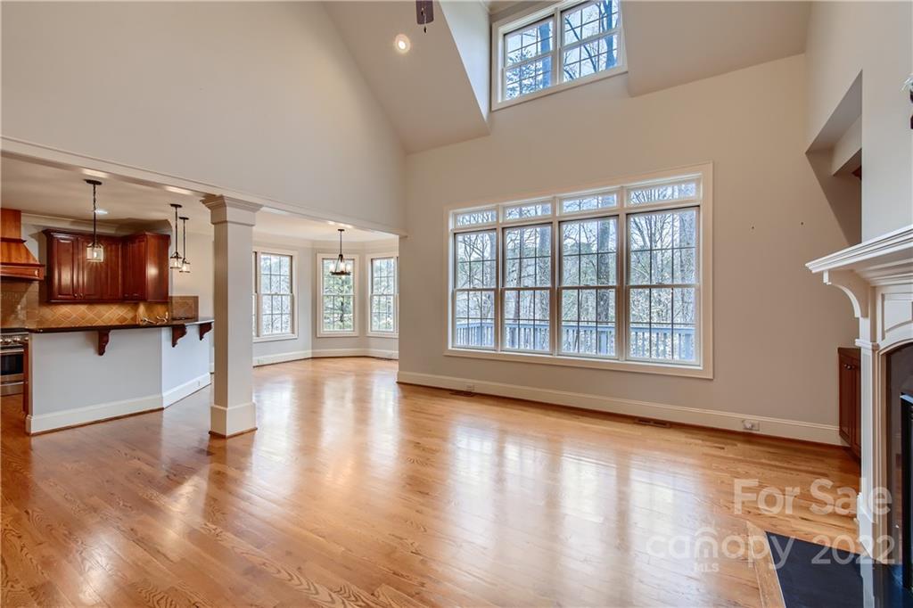 7653 Juniper Lane Denver, NC 28037 - Photo 4 of 28 a view of an empty room with wooden floor and a window