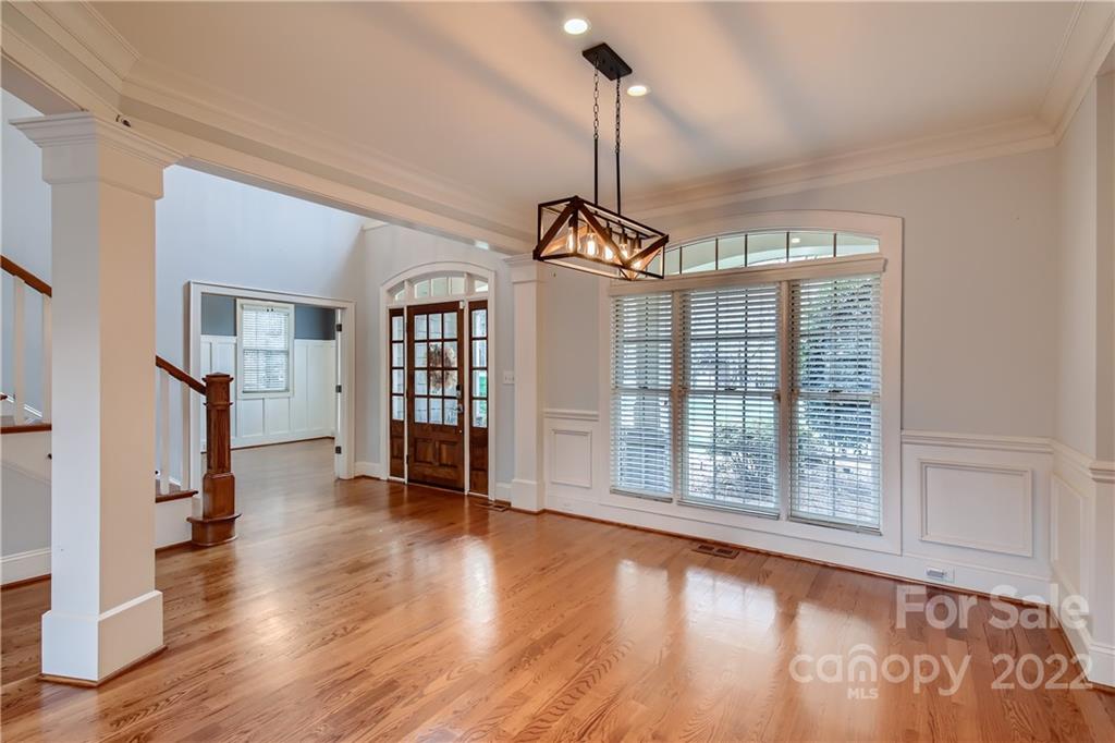 7653 Juniper Lane Denver, NC 28037 - Photo 6 of 28 a view of an empty room with a window and wooden floor