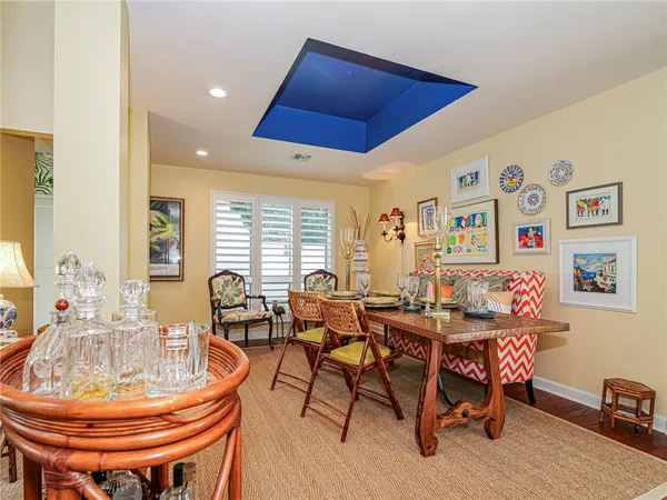 a dining room with furniture and wooden floor