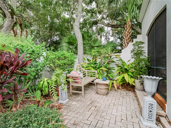 a view of a chairs and table in a backyard