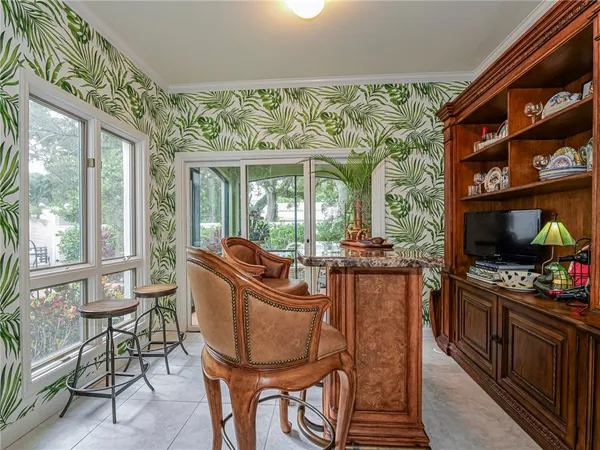 a living room with fireplace furniture and a flat screen tv
