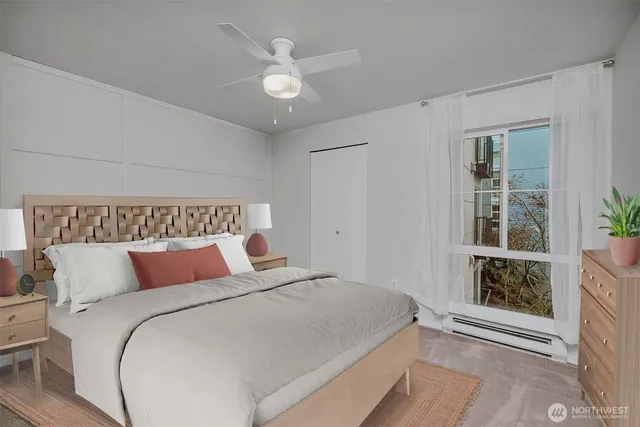 a bedroom with a large bed and a window