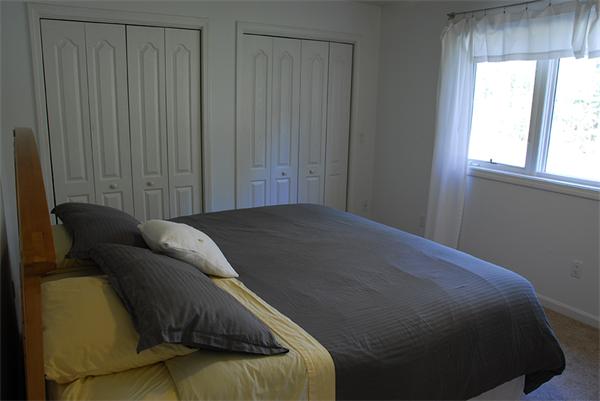5 Warren Road Wilbraham, MA 01095 - Photo 18 of 29 a bed sitting in a bedroom next to a window