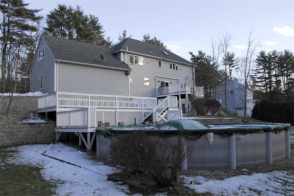 5 Warren Road Wilbraham, MA 01095 - Photo 25 of 29 a front view of a house with a wooden fence
