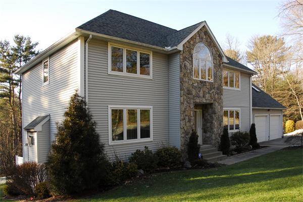 5 Warren Road Wilbraham, MA 01095 - Photo 28 of 29 a front view of a house with a yard and garage