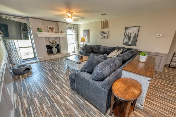 a living room with furniture and a fireplace