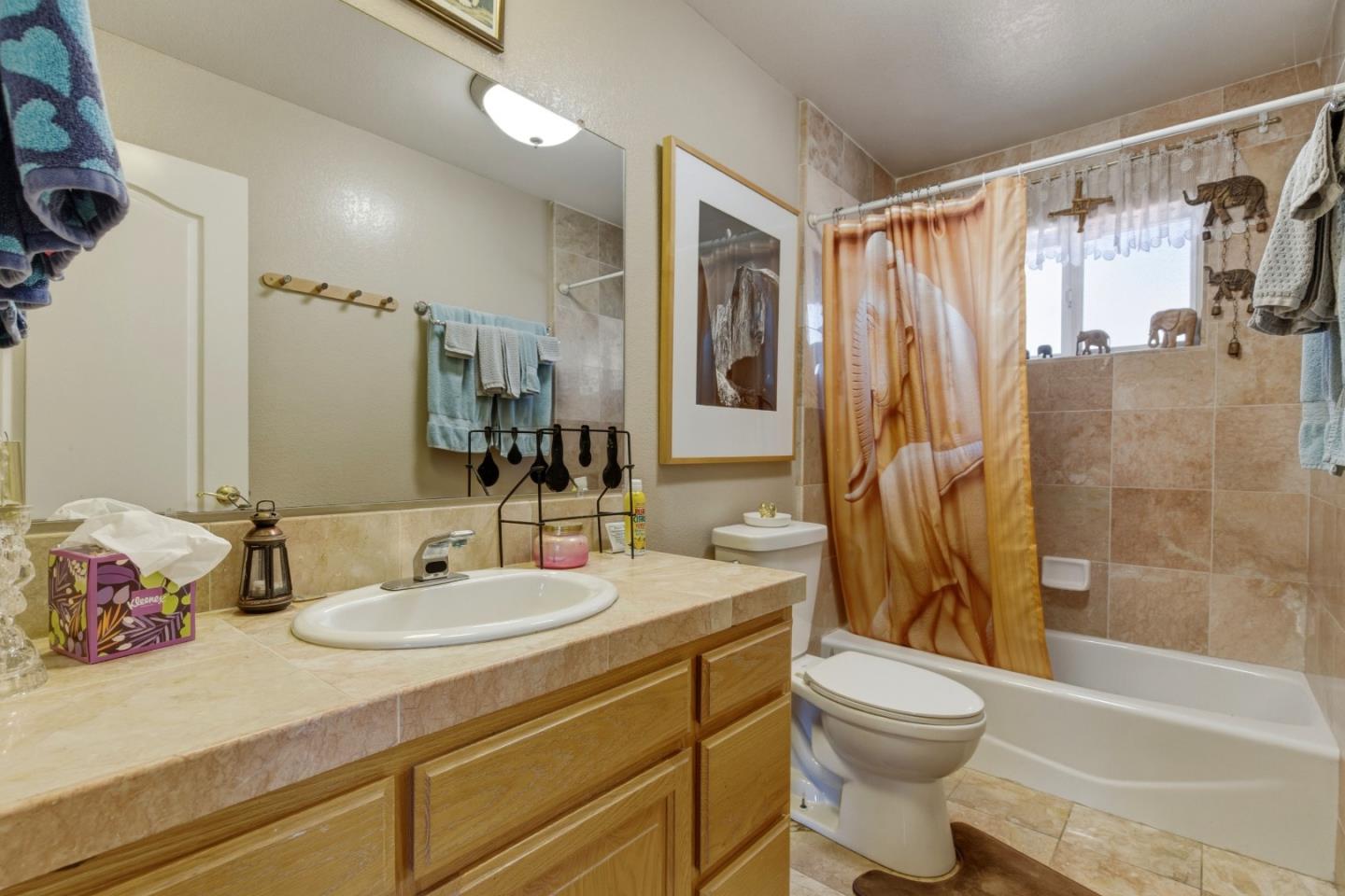 38780 Dinosaur Point Road Hollister, CA 95023 - Photo 8 of 34 a bathroom with a sink toilet tub and shower