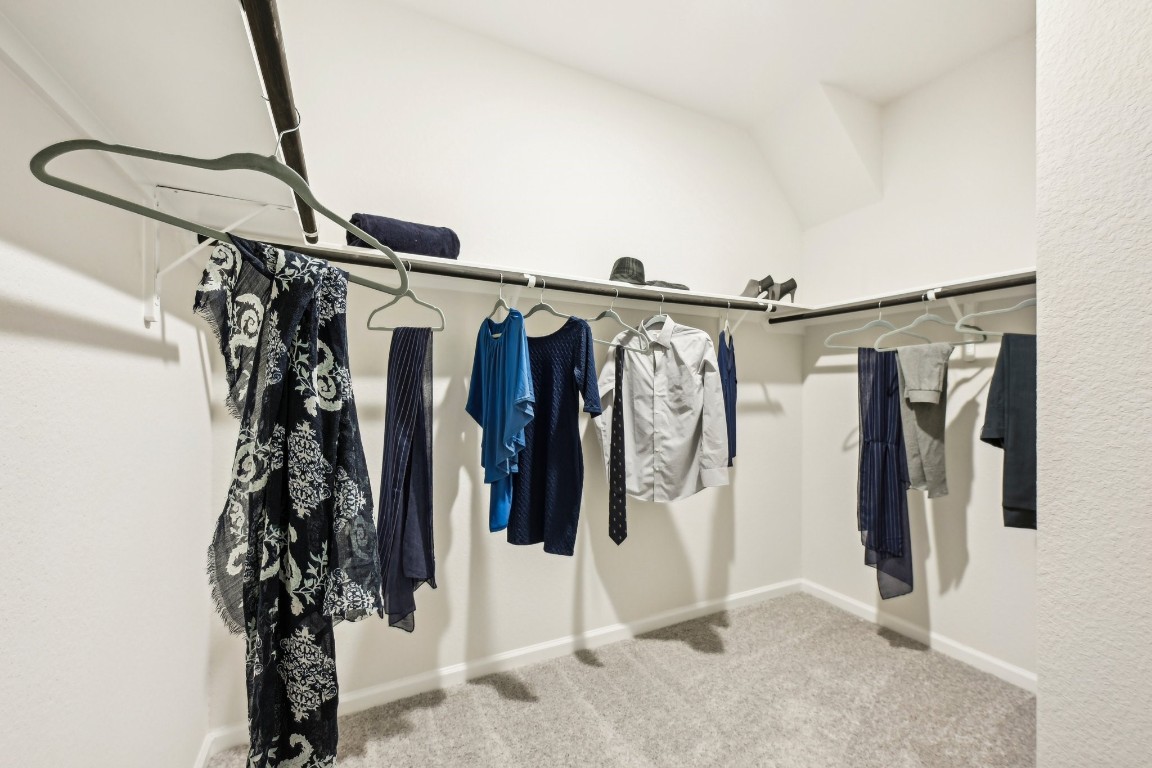 9706 Enclave Ridge Road Willis, TX 77318 - Photo 14 of 19 Oakshire II- Primary Closet. Sample image for illustration; upgrades, options, and colors may vary.