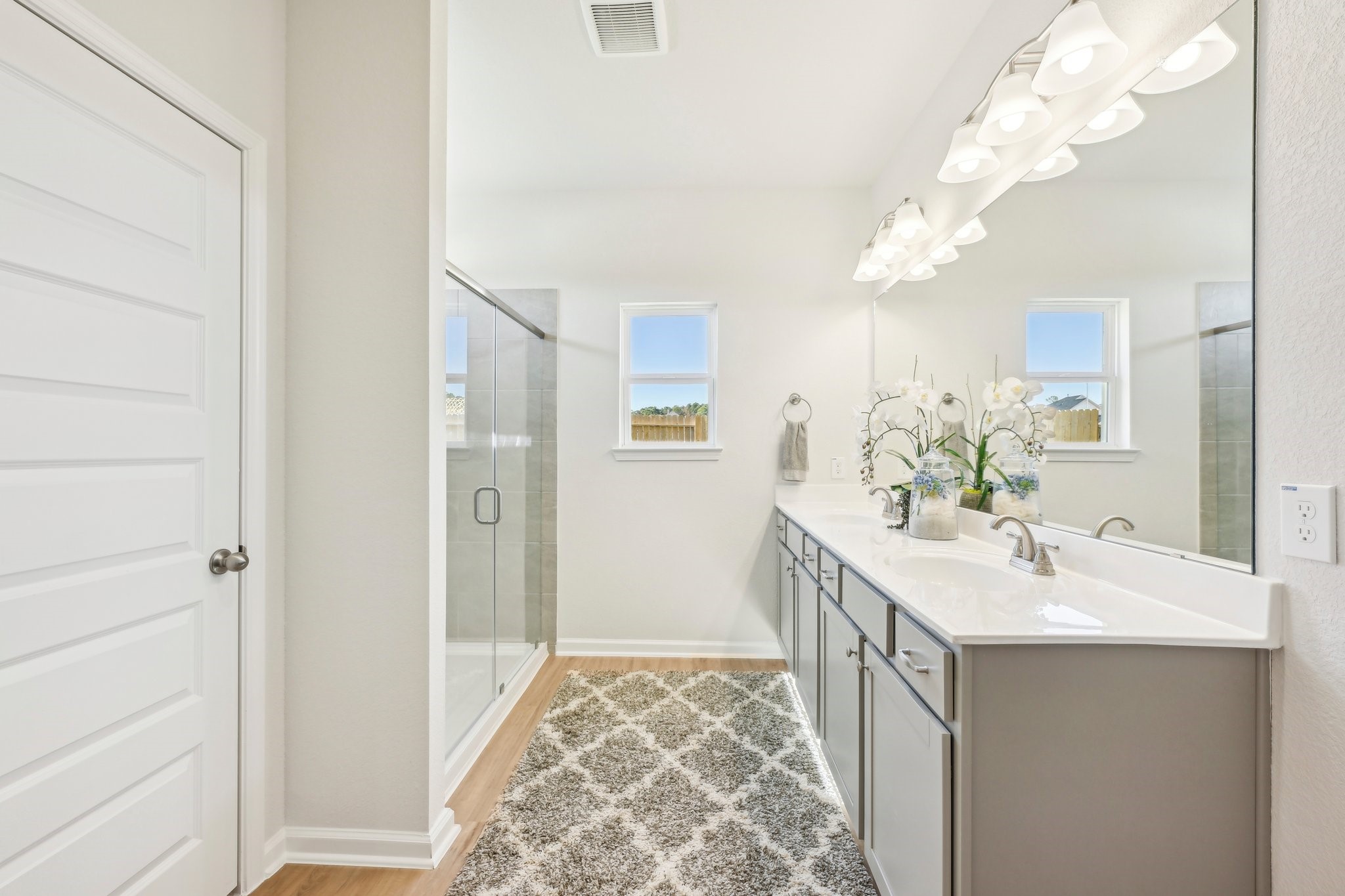 9706 Enclave Ridge Road Willis, TX 77318 - Photo 15 of 19 a bathroom with a double vanity sink and a mirror