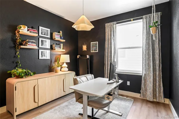 a dining room with furniture and window