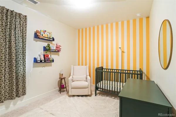 a bedroom with a bed and a couch