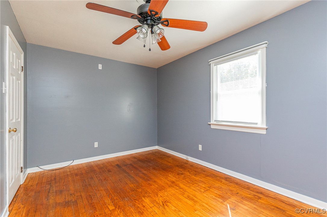 8929 Old Elam Cemetary Road Charles City, VA 23030 - Photo 15 of 20 Spare room featuring wood-type flooring and ceilin