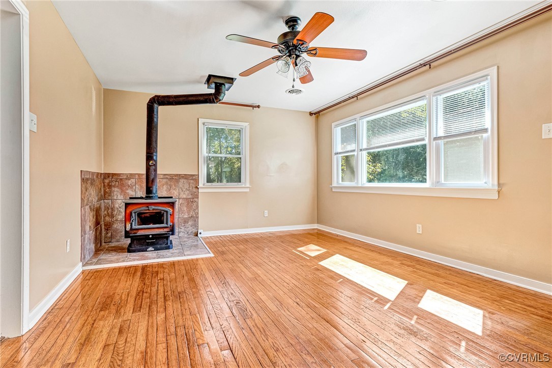 8929 Old Elam Cemetary Road Charles City, VA 23030 - Photo 4 of 20 Unfurnished living room featuring a wood stove, li