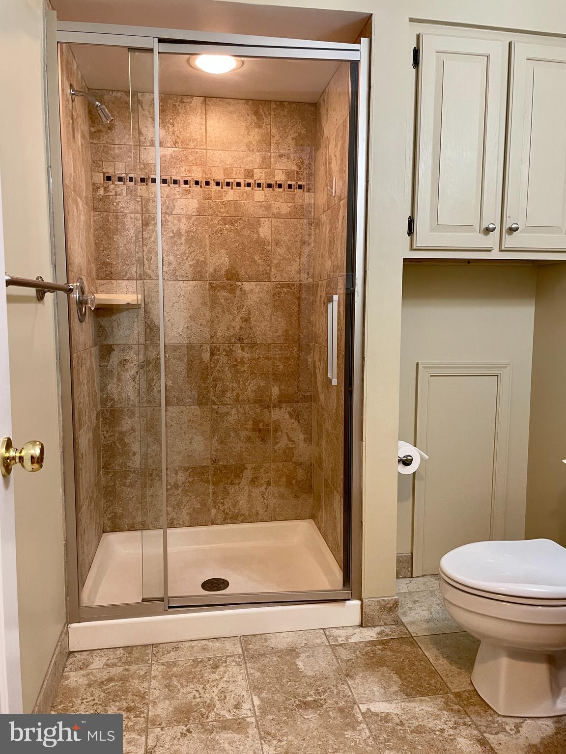 503 Brighton Road Devon, PA 19333 - Photo 14 of 20 a bathroom with a shower a toilet and a sink