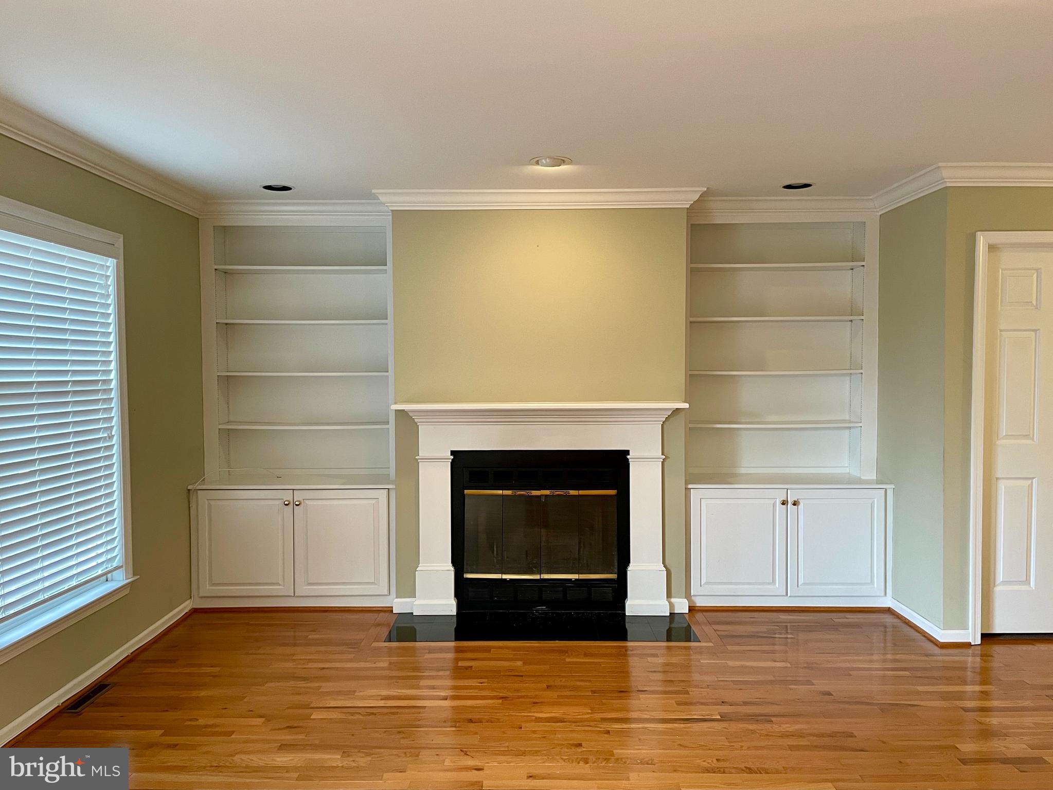 503 Brighton Road Devon, PA 19333 - Photo 9 of 20 a living room with a fireplace and a table