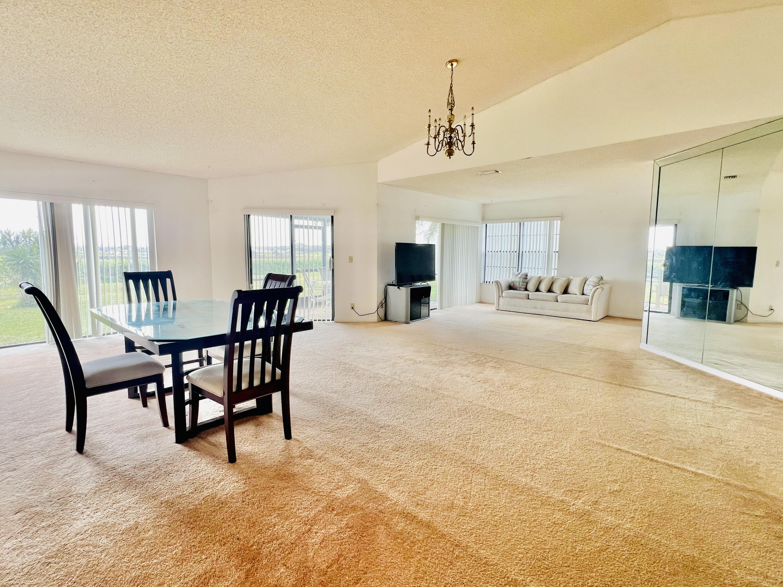 9690 Triton Court Boca Raton, FL 33434 - Photo 11 of 33 a view of a dining room with furniture