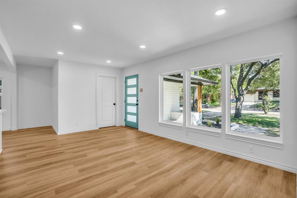 2108 Blake Avenue Dallas, TX 75228 - Photo 10 of 24 Unfurnished living room with recessed lighting and light wood-style flooring