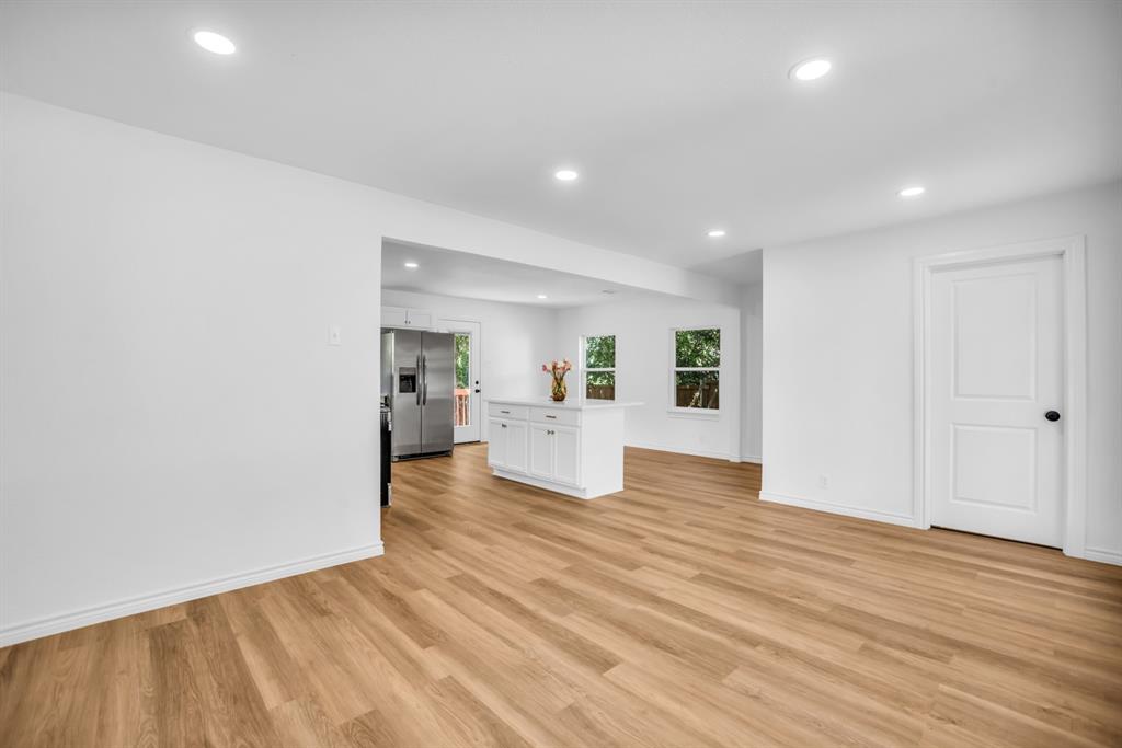 2108 Blake Avenue Dallas, TX 75228 - Photo 11 of 24 Unfurnished living room with recessed lighting and light wood-style floors