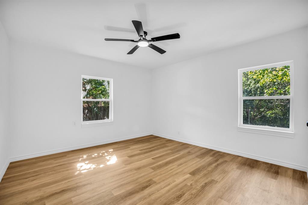 2108 Blake Avenue Dallas, TX 75228 - Photo 19 of 24 Unfurnished room with light wood-style flooring and ceiling fan