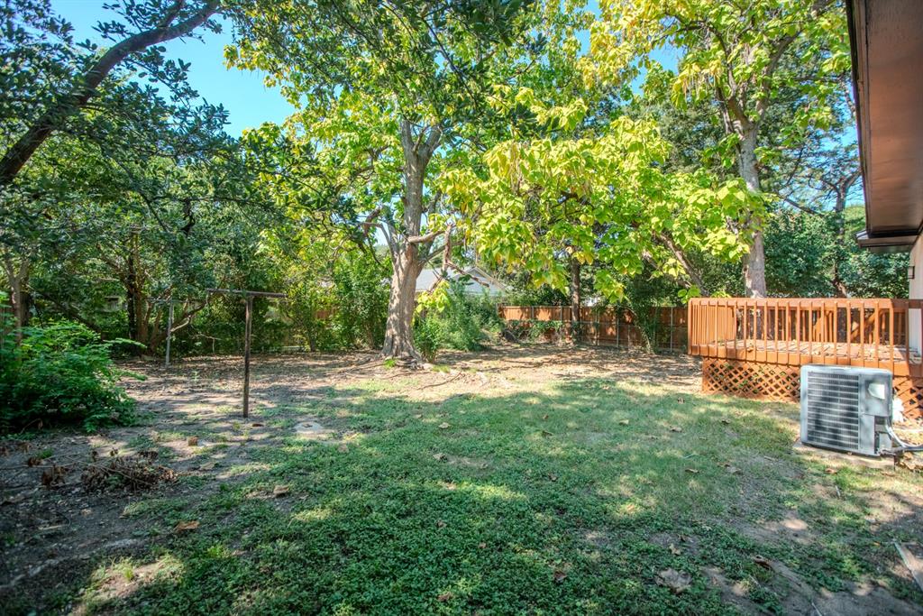 2108 Blake Avenue Dallas, TX 75228 - Photo 21 of 24 Fenced backyard with a wooden deck