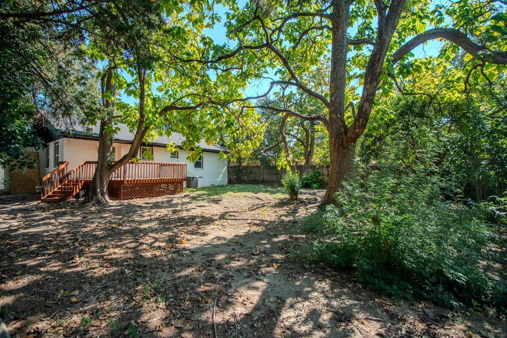 2108 Blake Avenue Dallas, TX 75228 - Photo 23 of 24 View of yard featuring a wooden deck and stairway