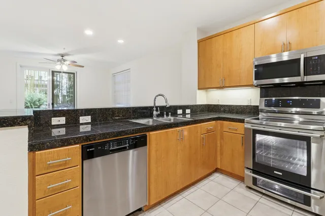 a kitchen with a refrigerator stove and microwave