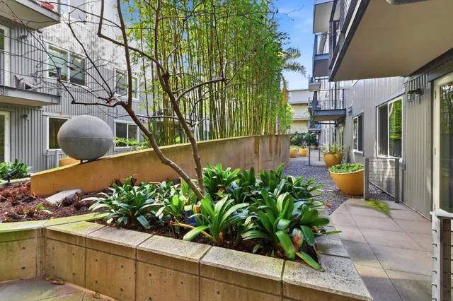a view of parking garage with cars