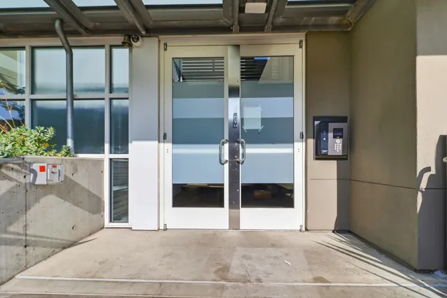 a bathroom with a glass shower door