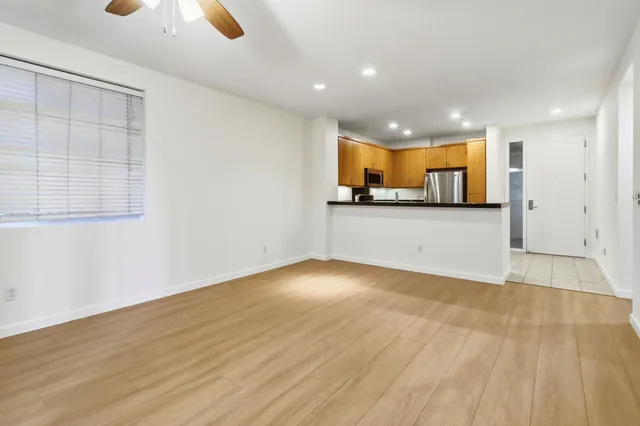 a kitchen with granite countertop a stove and a sink