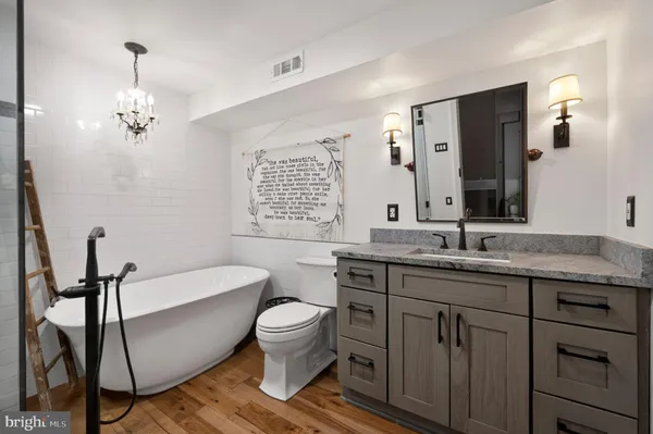 a bathroom with a shower a toilet and a shower