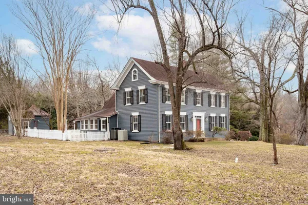 a view of a house with a snow in the yard