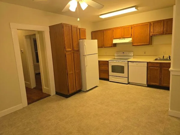 a kitchen with stainless steel appliances a refrigerator and cabinets