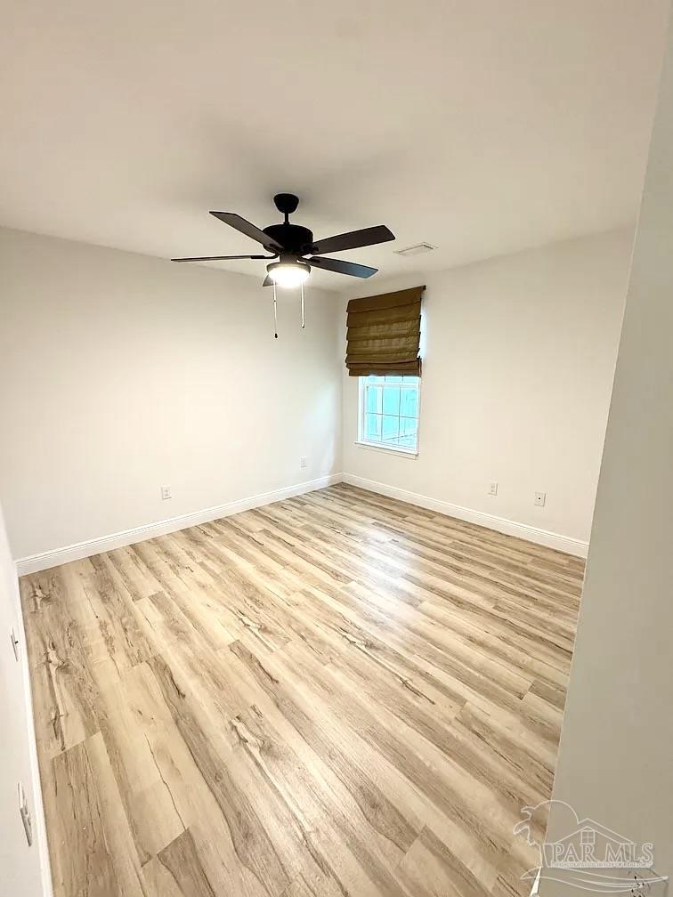 1910 West Kingsfield Road Cantonment, FL 32533 - Photo 8 of 8 a view of empty room with wooden floor