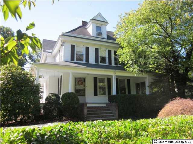 19 Ridge Road Rumson, NJ 07760 - Photo 1 of 3 a front view of a house with a yard