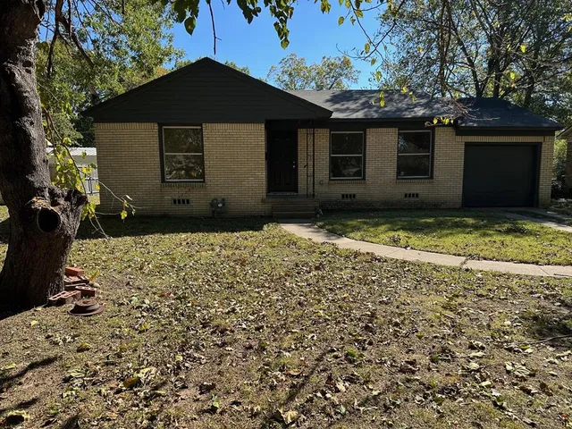 a house with trees in front of it