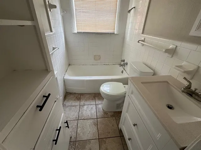 a bathroom with a sink and a bathtub