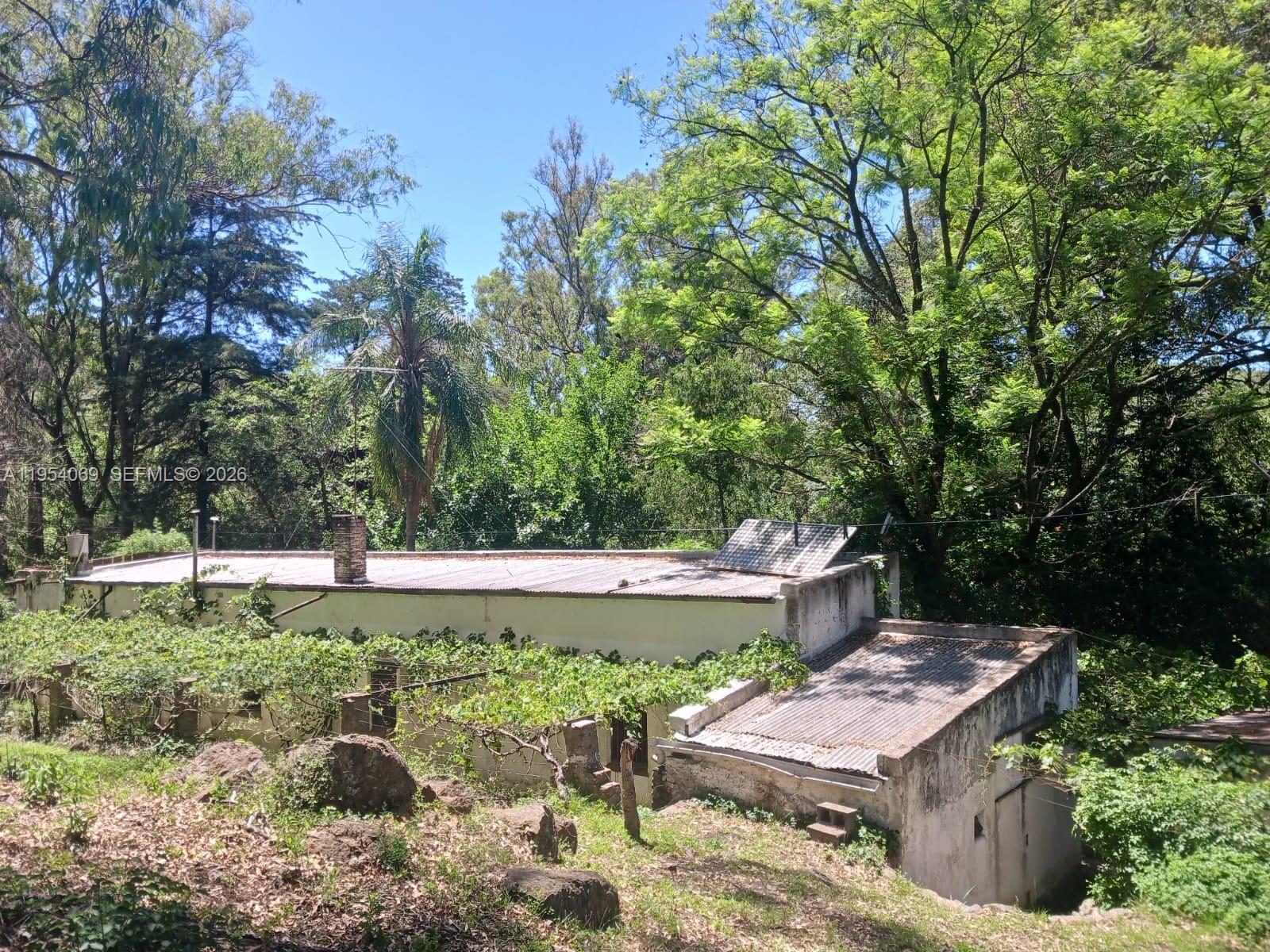 1 Segundo Paredon undefined, undefined 5186 - Photo 56 of 57 a backyard of a house with a yard and outdoor seating