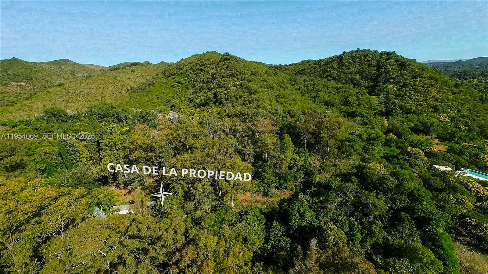 1 Segundo Paredon undefined, undefined 5186 - Photo 6 of 57 a view of a lush green forest with houses in the back