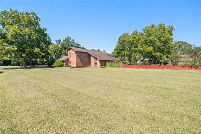 a house with trees in the background